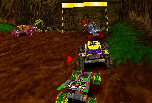 A screenshot from Buggy. Some carts are on a dirt track approaching a gate.